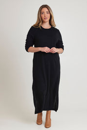 Model Chanel wearing size XL of The Keepers Soft Knit Maxi Dress in colour Black (Black), from the front, showing the whole outfit