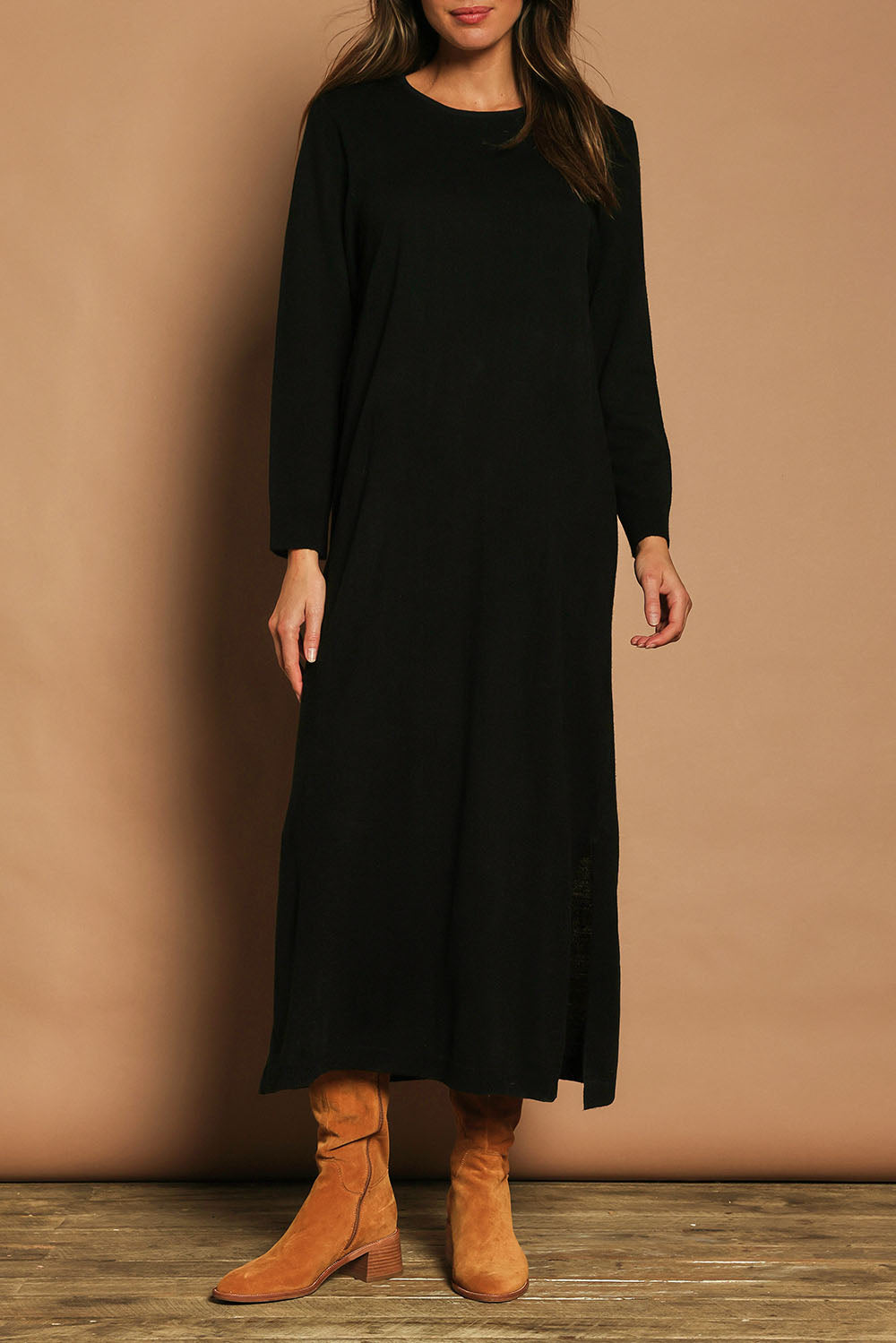Model Madeline wearing size S of The Keepers Soft Knit Maxi Dress in colour Black (Black), from the front, cropped image