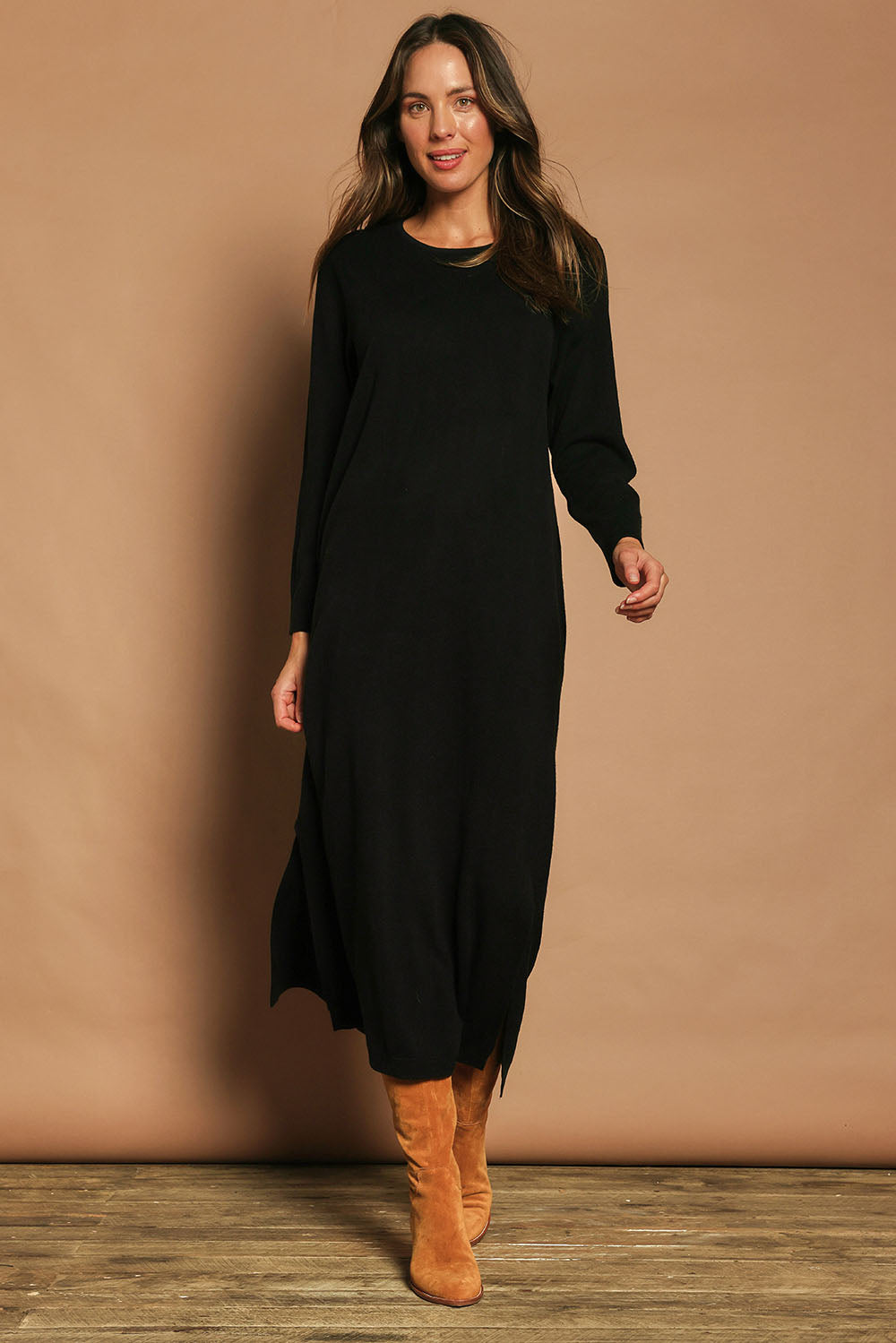 Model Madeline wearing size S of The Keepers Soft Knit Maxi Dress in colour Black (Black), from the front, showing the whole outfit