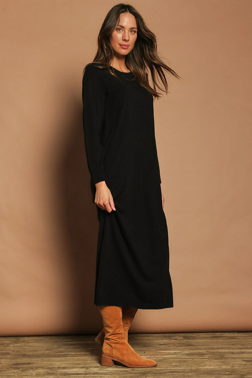 Model Madeline wearing size S of The Keepers Soft Knit Maxi Dress in colour Black (Black), from the front, showing the whole outfit