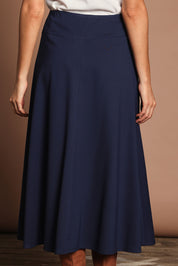 Model Madeline wearing size 10 of The Fit And Flare Ponte Skirt in colour Frenchnavy (Blue), from the back