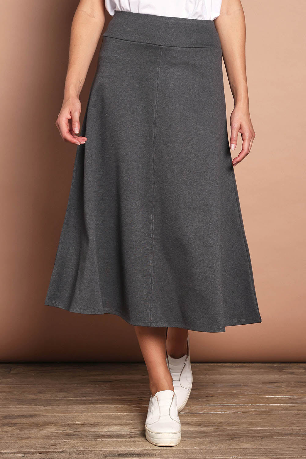 Model Madeline wearing size 10 of The Fit And Flare Ponte Skirt in colour Greymarle (Grey), from the front, cropped image