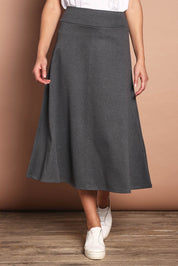 Model Madeline wearing size 10 of The Fit And Flare Ponte Skirt in colour Greymarle (Grey), from the front, cropped image