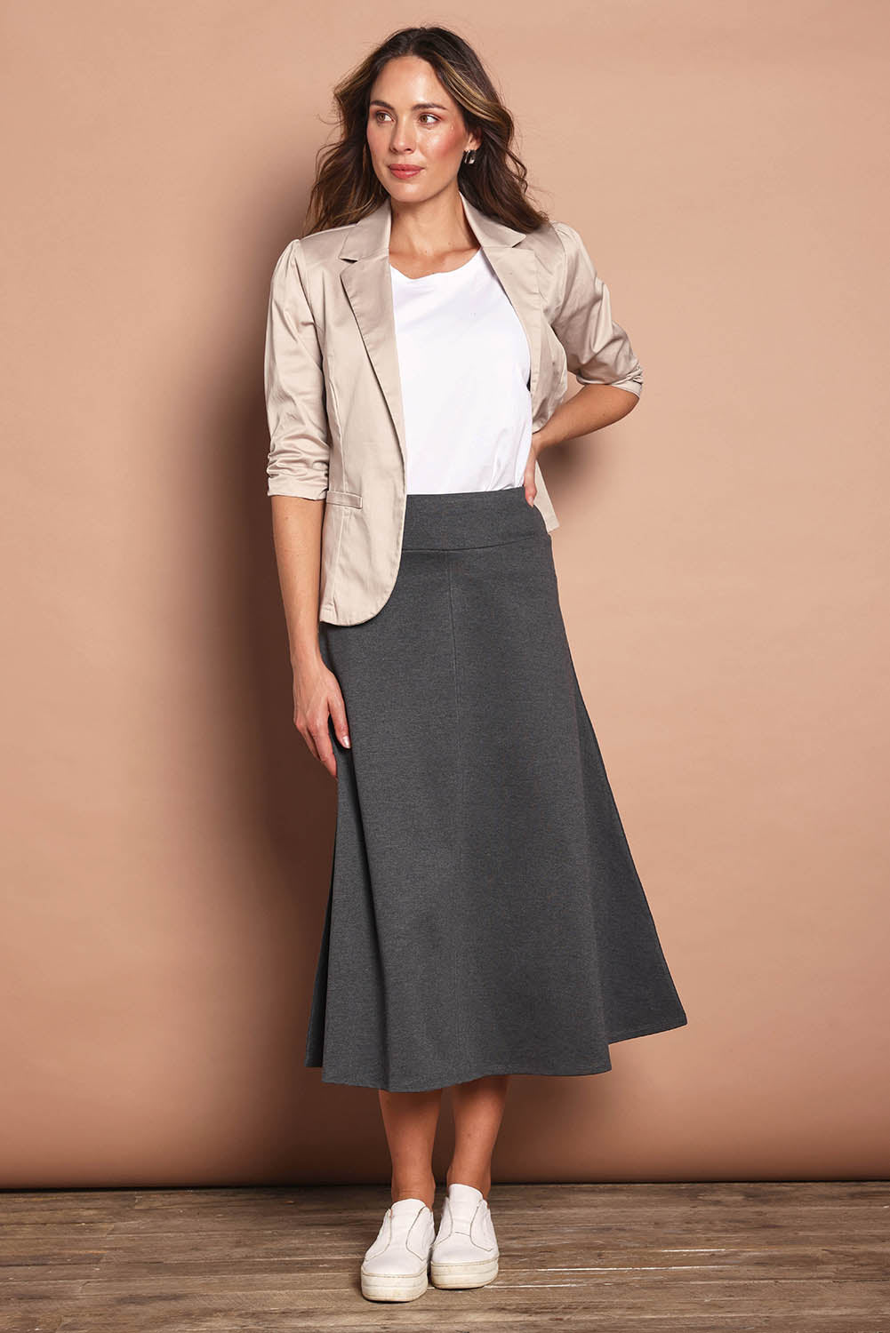 Model Madeline wearing size 10 of The Fit And Flare Ponte Skirt in colour Greymarle (Grey), from the front, showing the whole outfit