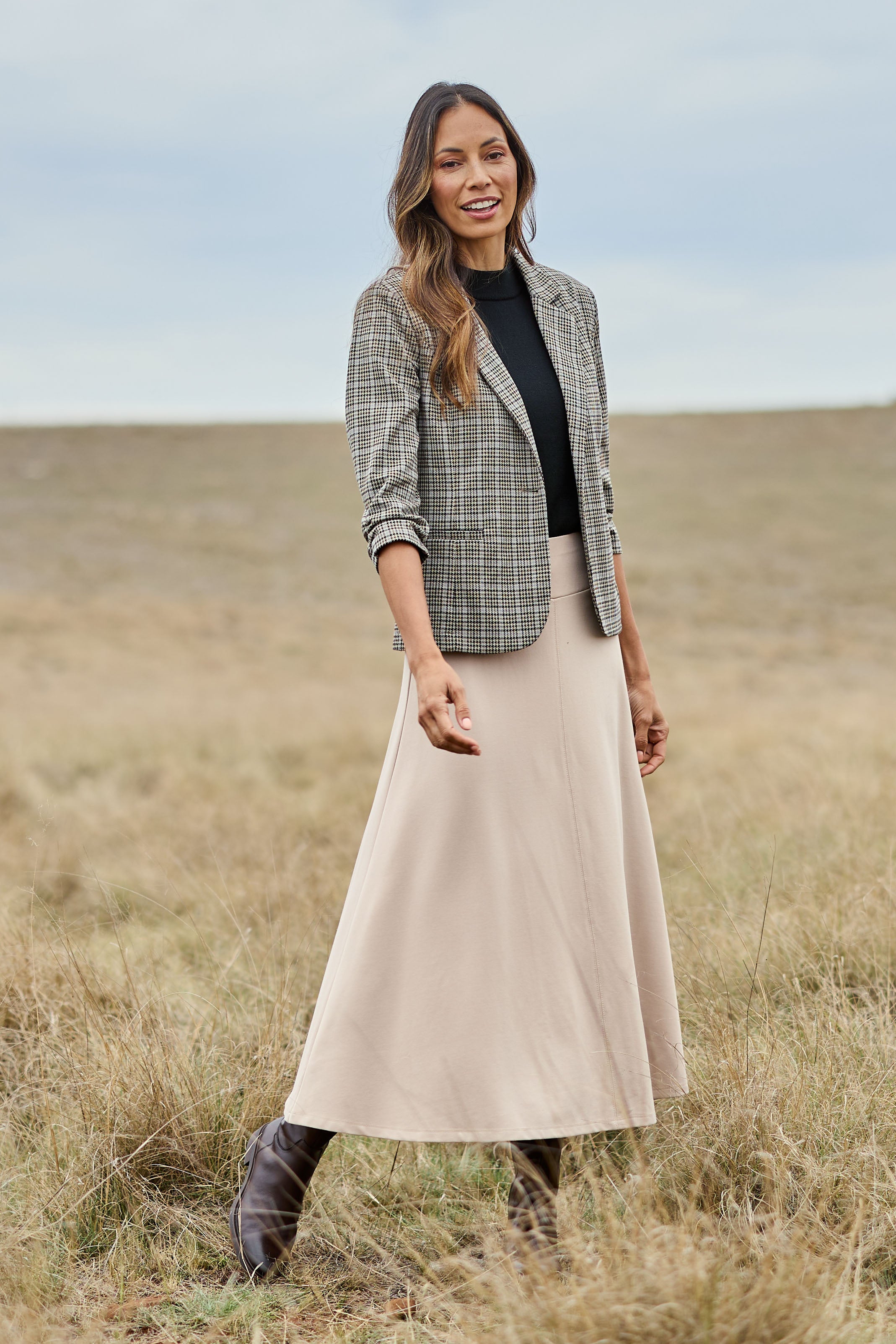 Model Amanda wearing size 10 of The Fit And Flare Ponte Skirt in colour Nougat, from the front, showing the whole outfit