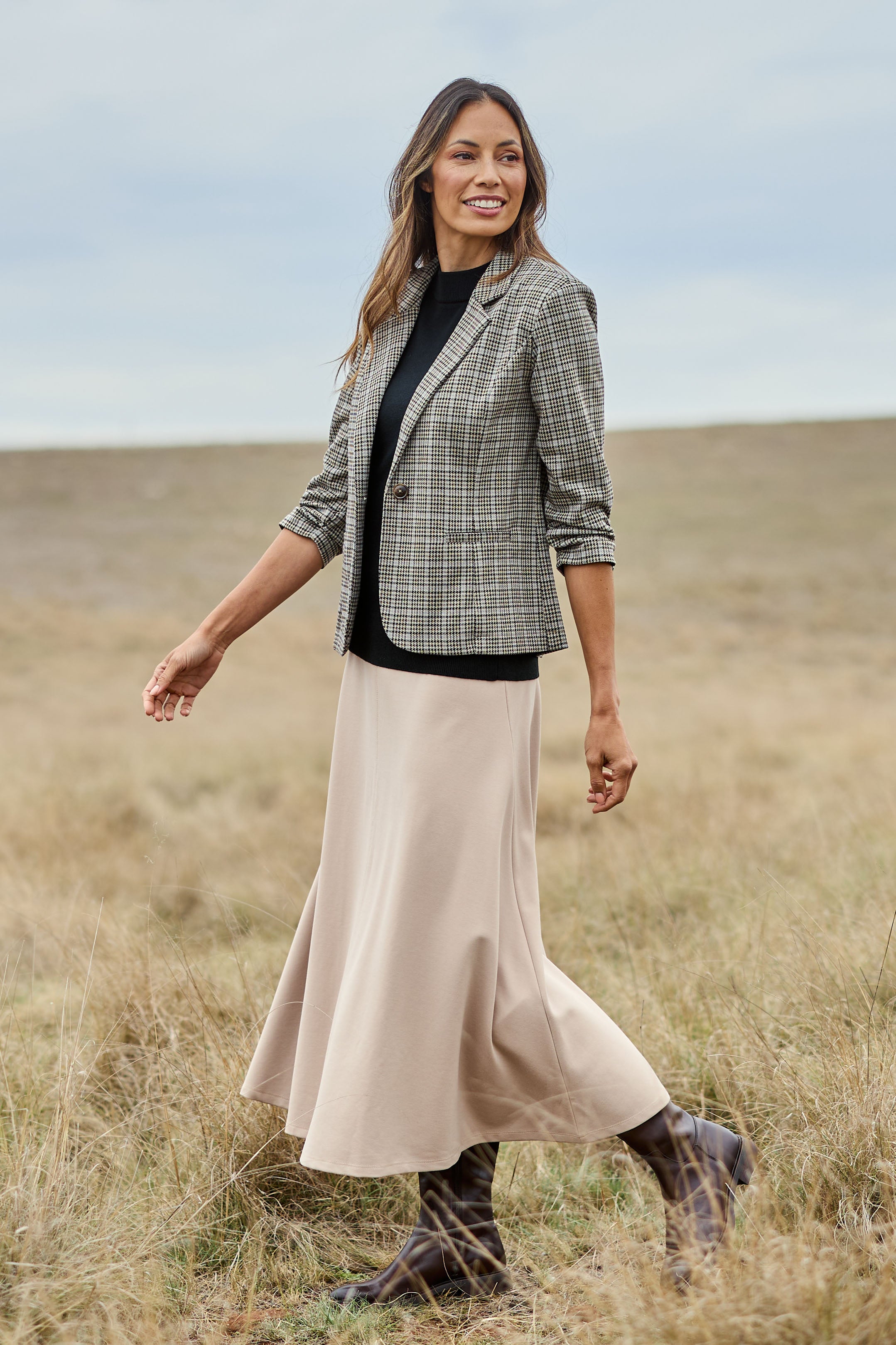 Model Amanda wearing size 10 of The Fit And Flare Ponte Skirt in colour Nougat, from the front, showing the whole outfit
