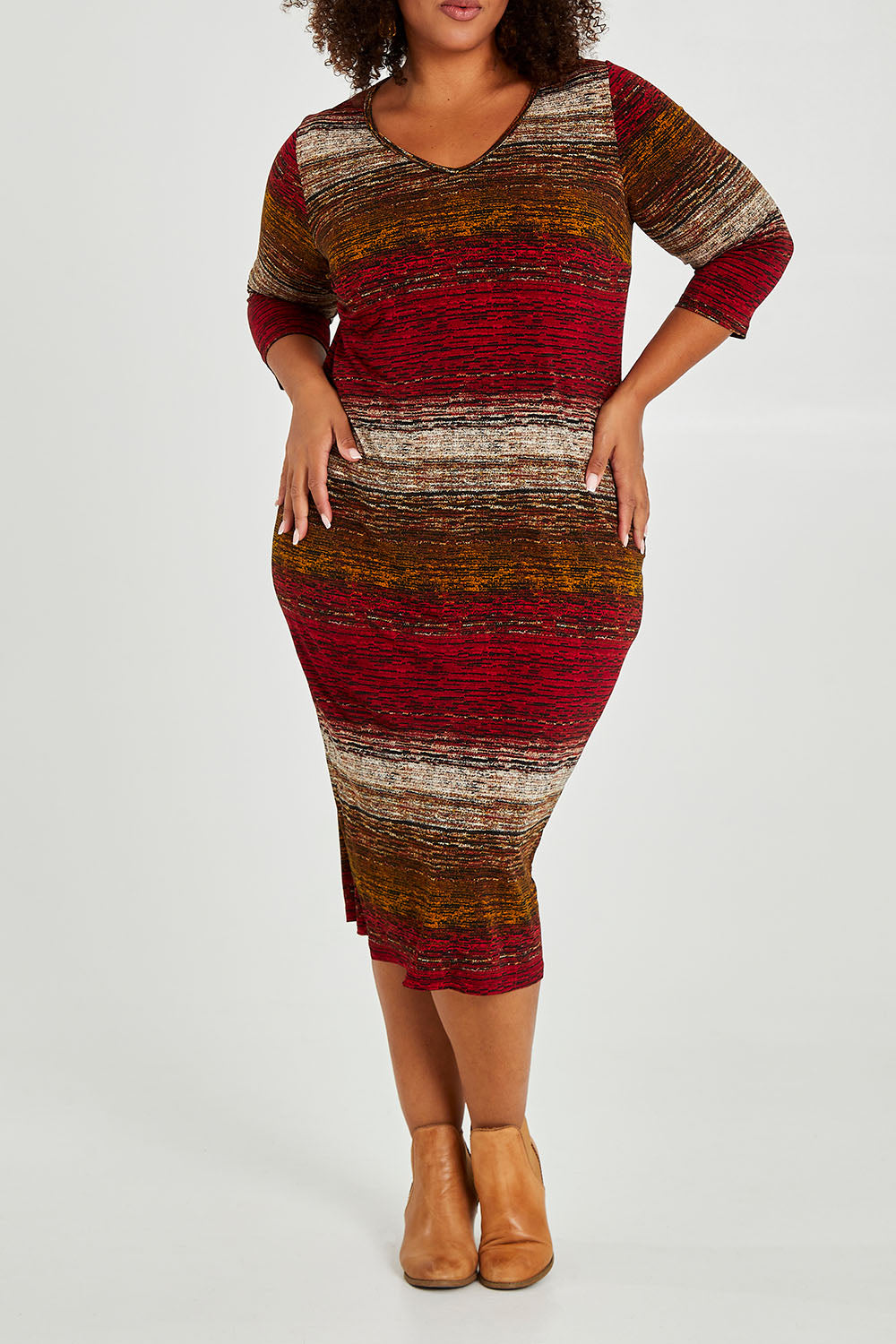 Model Alexis wearing size 16 of The Print Everyday V Neck Dress in colour Multistrip (Red), from the front, cropped image