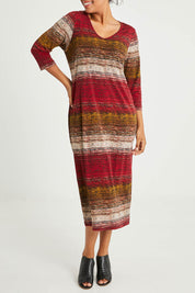 Model Noli wearing size 14 of The Print Everyday V Neck Dress in colour Multistrip (Red), from the front, cropped image