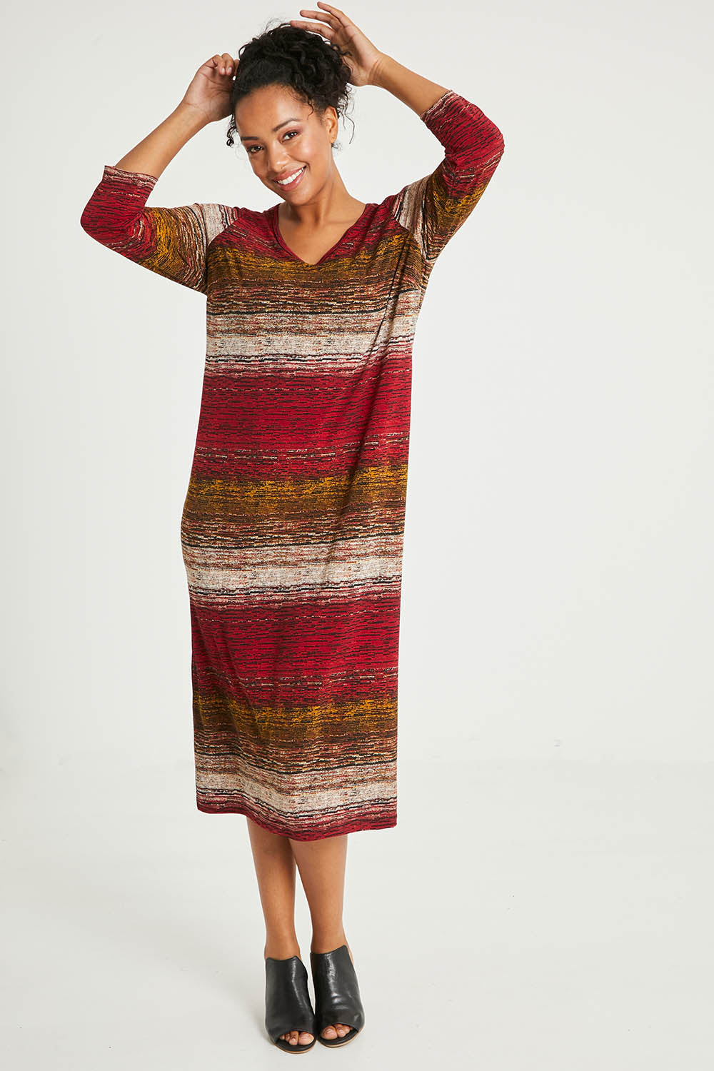 Model Noli wearing size 14 of The Print Everyday V Neck Dress in colour Multistrip (Red), from the front, showing the whole outfit