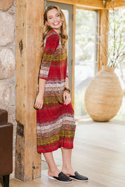 Model Tahlia wearing size 10 of The Print Everyday V Neck Dress in colour Multistrip (Red), from the front, showing the whole outfit