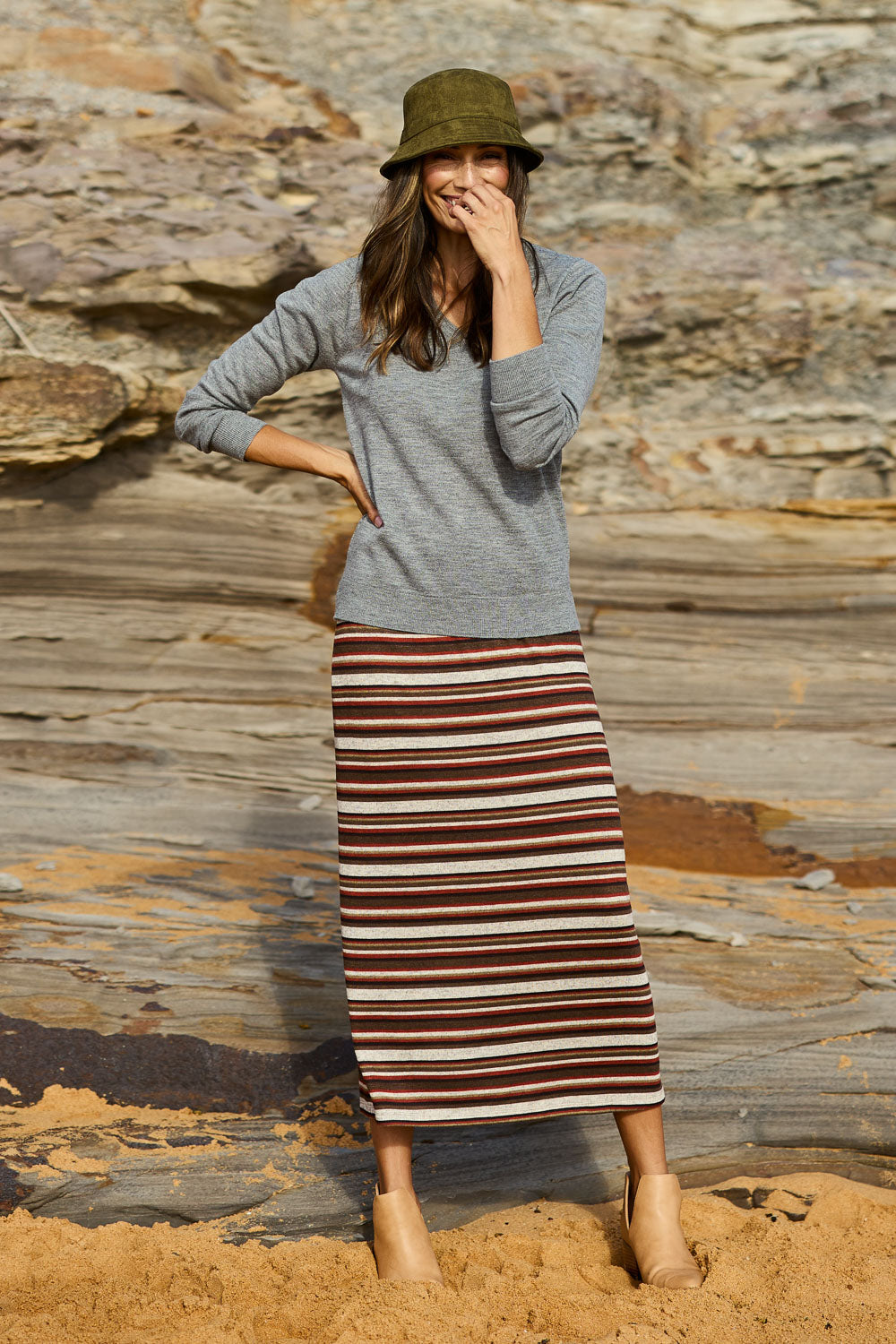 Model Amanda wearing size 10 of The Striped Knit Lined Skirt in colour Warmtones (Grey), from the front, showing the whole outfit