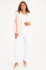 Model Monique wearing size 14 of The Everyday Long Sleeve Blazer in colour Blush (Pink), from the front, showing the whole outfit