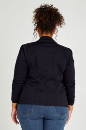 Model Alexis wearing size 16 of The Everyday Long Sleeve Blazer in colour Darknavy (Blue), from the back