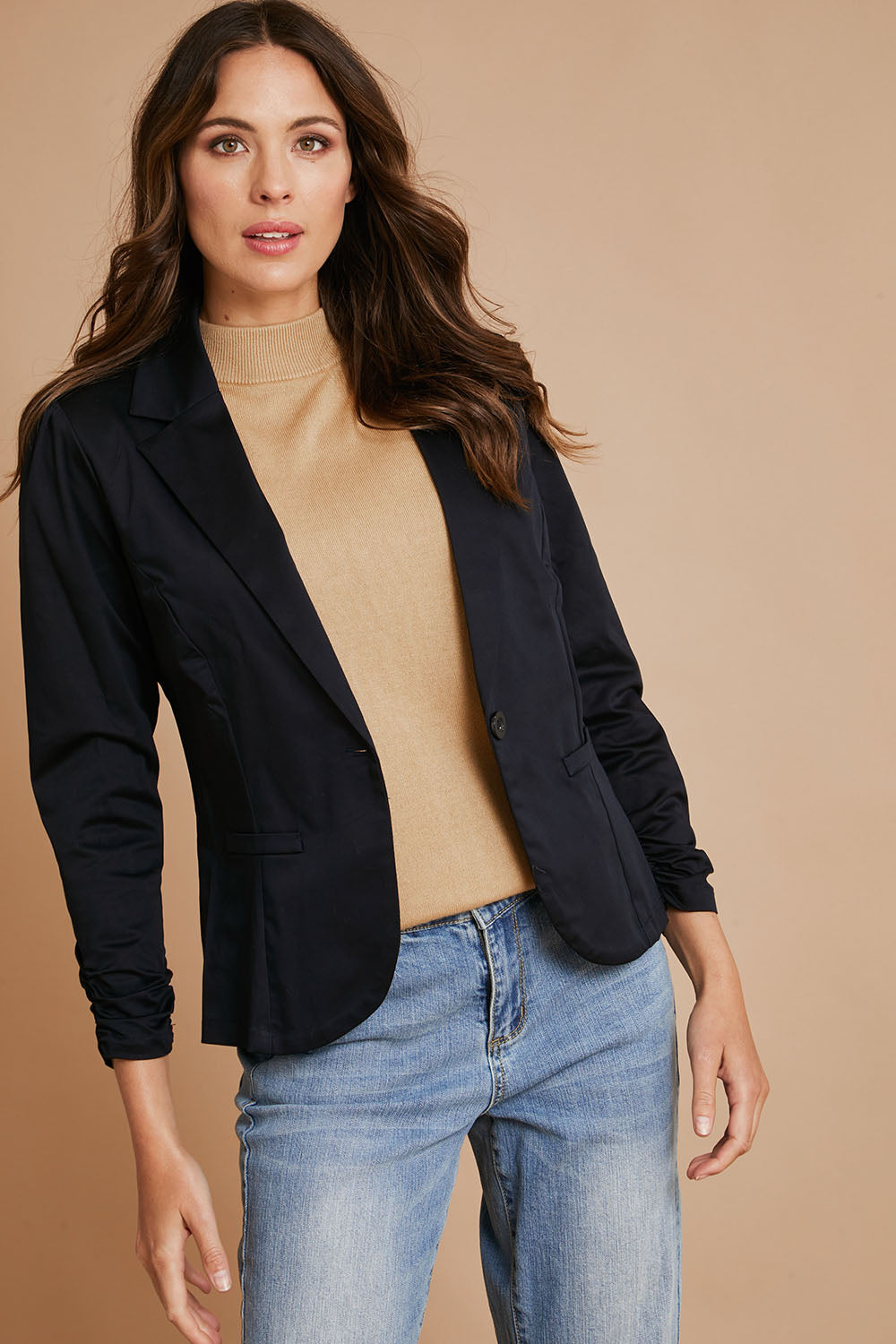 Model Madeline wearing size 10 of The Everyday Long Sleeve Blazer in colour Darknavy (Blue), from the front, showing the whole outfit