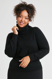 Model Alexis wearing size XL of The Keepers Soft Roll Neck Jumper in colour Black (Black), from the front, cropped image