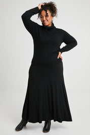 Model Alexis wearing size XL of The Keepers Soft Roll Neck Jumper in colour Black (Black), from the front, showing the whole outfit