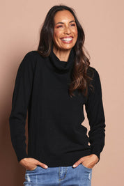 Model Amanda wearing size S of The Keepers Soft Roll Neck Jumper in colour Black (Black), from the front, cropped image