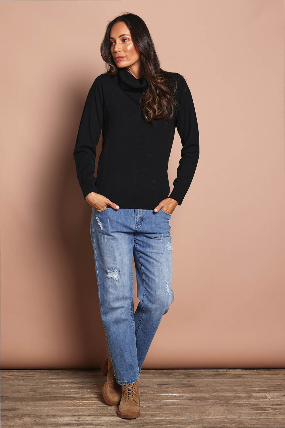 Model Amanda wearing size S of The Keepers Soft Roll Neck Jumper in colour Black (Black), from the front, showing the whole outfit