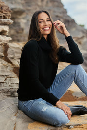 Model Amanda wearing size S of The Keepers Soft Roll Neck Jumper in colour Black (Black), from the front, showing the whole outfit
