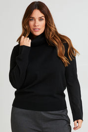 Model Laura wearing size L of The Keepers Soft Roll Neck Jumper in colour Black (Black), from the front, cropped image