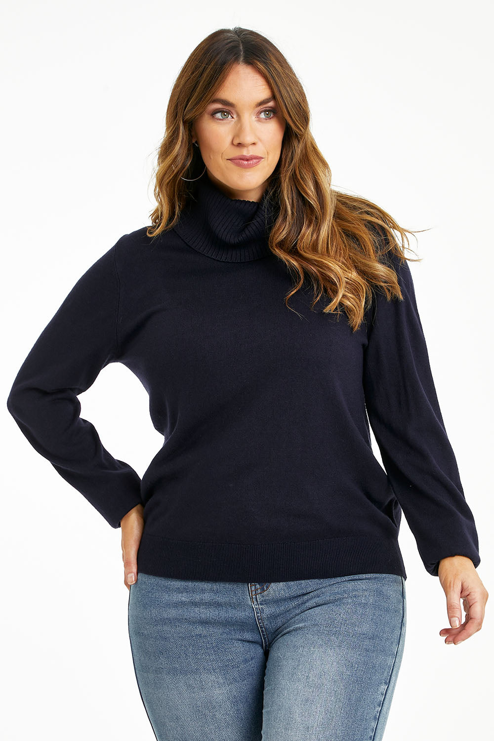 Model Laura wearing size L of The Keepers Soft Roll Neck Jumper in colour Darknavy (Blue), from the front, cropped image
