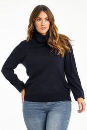 Model Laura wearing size L of The Keepers Soft Roll Neck Jumper in colour Darknavy (Blue), from the front, cropped image
