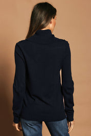 Model Madeline wearing size S of The Keepers Soft Roll Neck Jumper in colour Darknavy (Blue), from the back