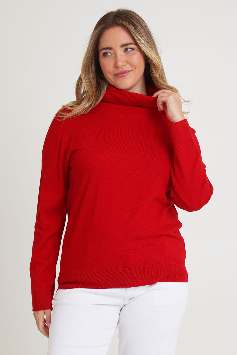 Model Chanel wearing size XL of The Keepers Soft Roll Neck Jumper in colour Red (Red), from the front, cropped image