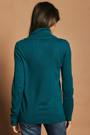 Model Madeline wearing size S of The Keepers Soft Roll Neck Jumper in colour Turquoise (Green), from the back