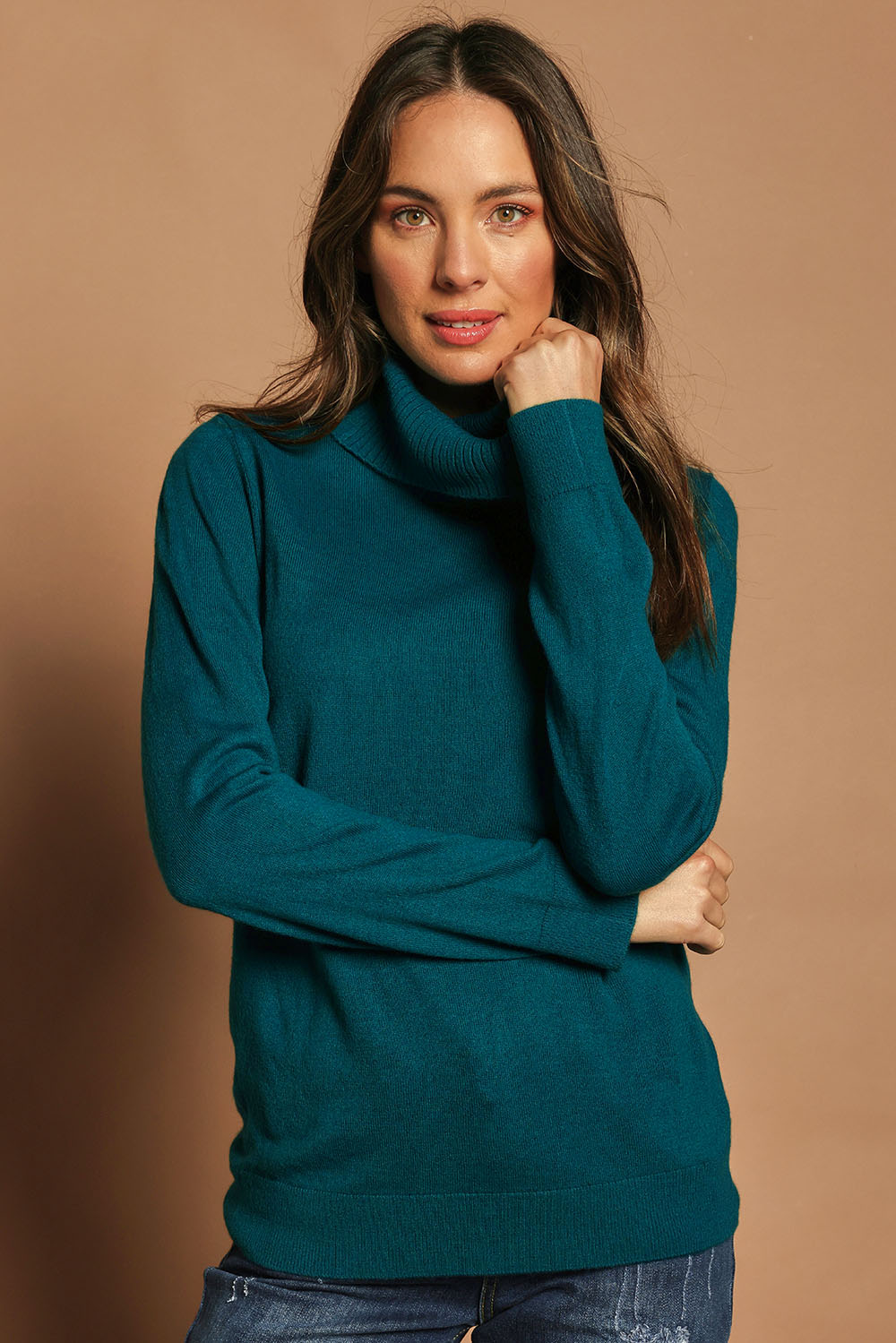 Model Madeline wearing size S of The Keepers Soft Roll Neck Jumper in colour Turquoise (Green), from the front, cropped image