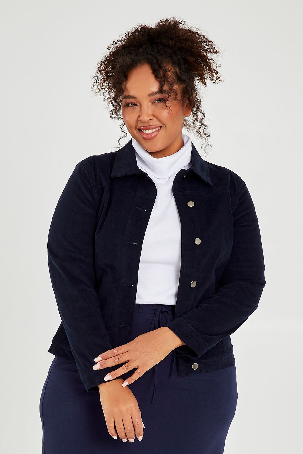 Model Alexis wearing size 16 of The Cord Casual Jacket in colour Navy (Blue), from the front, cropped image