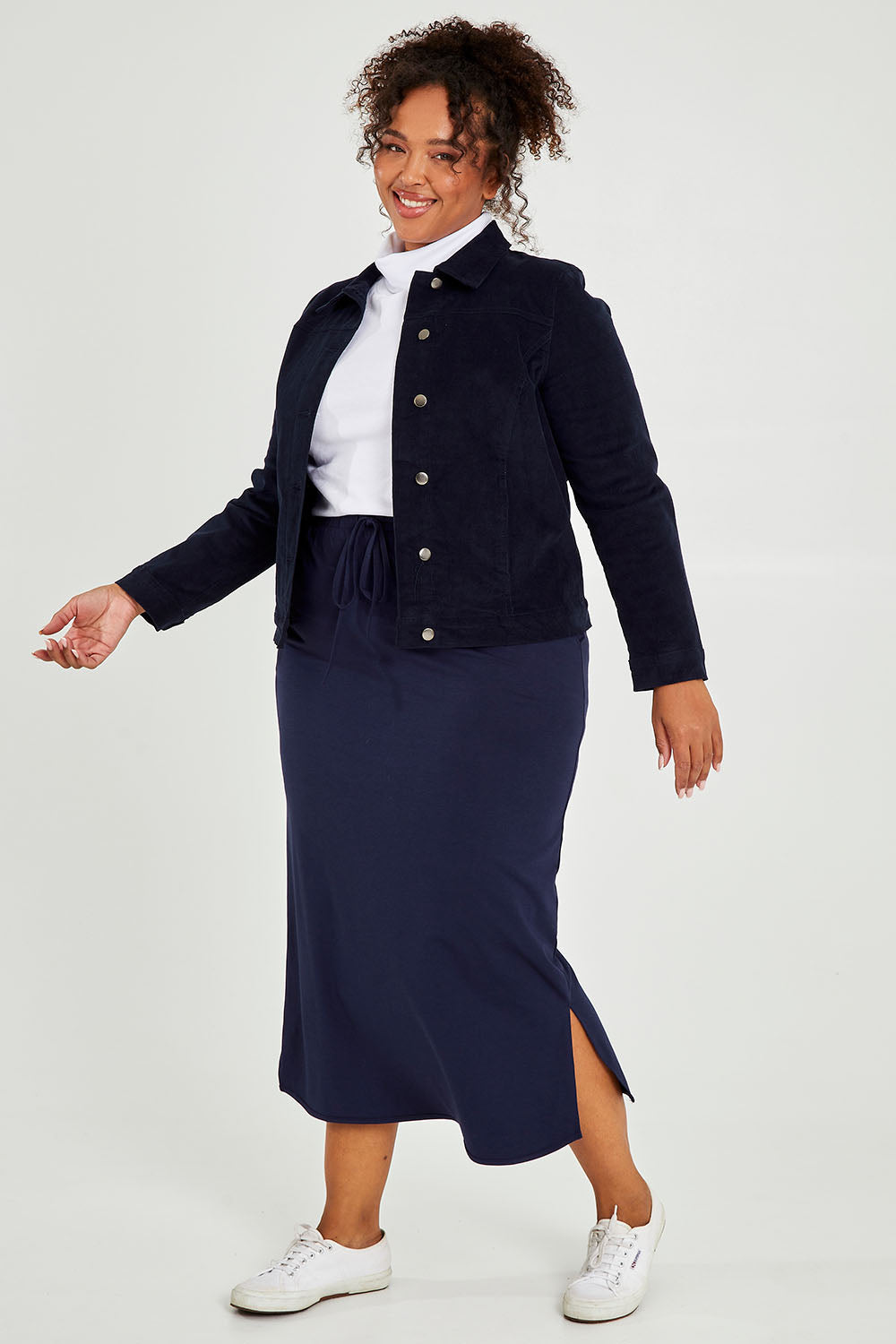 Model Alexis wearing size 18 of The Cord Casual Jacket in colour Navy (Blue), from the front, showing the whole outfit