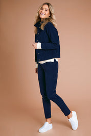 Model Alice wearing size 10 of The Cord Casual Jacket in colour Navy (Blue), from the front, showing the whole outfit