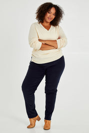 Model Alexis wearing size 16 of The Pull On Cord Pant in colour Navy (Blue), from the front, showing the whole outfit