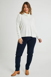 Model Laura wearing size 14 of The Pull On Cord Pant in colour Navy (Blue), from the front, showing the whole outfit