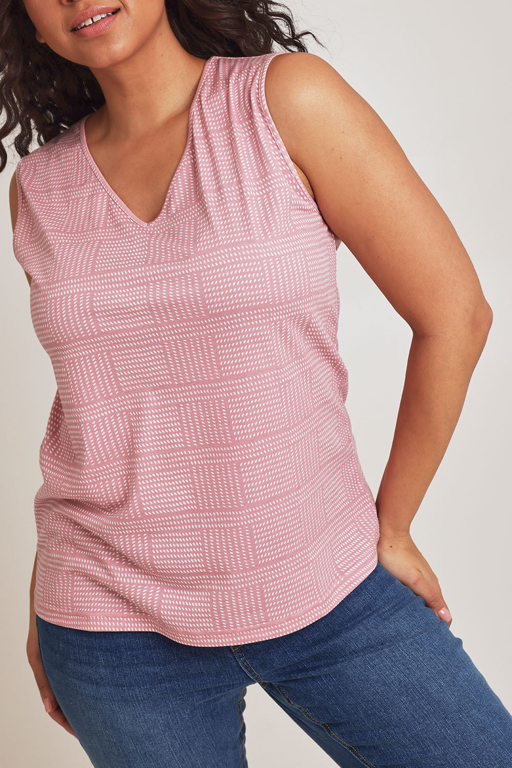 Model Terri-Leigh wearing size 14 of The Printed Bamboo Blend V Tank in colour Pinkblush (Pink), from the front, cropped image
