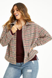 Model Laura wearing size 14 of The Houndstooth Bomber Jacket in colour Multicheck, from the front, cropped image
