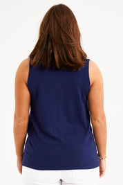 Model Monique wearing size L of The Transeasonal Knit Tank in colour Bluefizzer (Blue), from the back