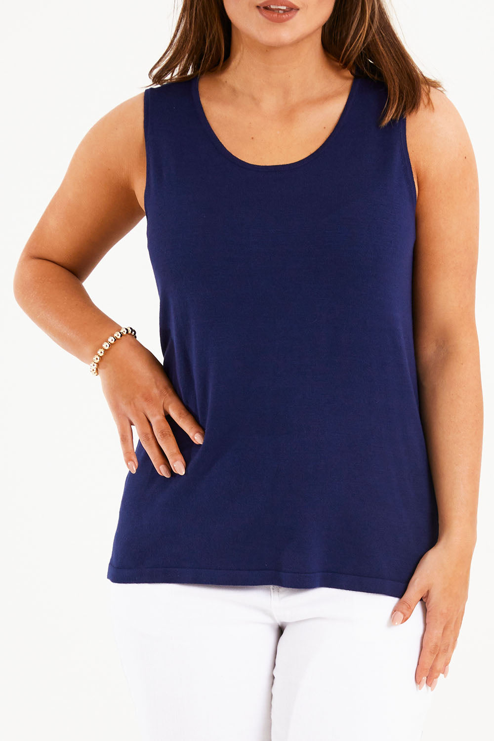 Model Monique wearing size L of The Transeasonal Knit Tank in colour Bluefizzer (Blue), from the front, cropped image