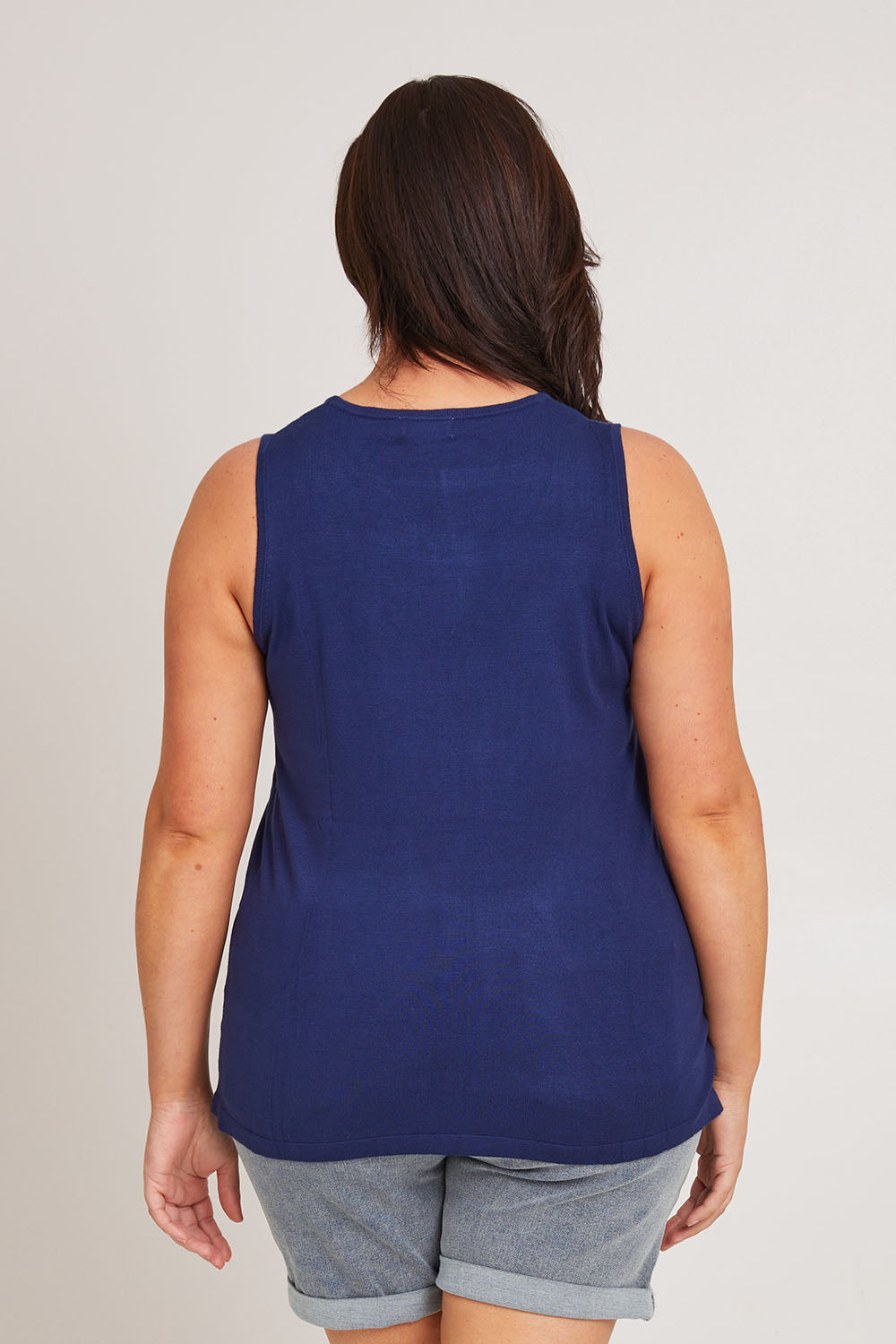 Model Poppy wearing size XL of The Transeasonal Knit Tank in colour Bluefizzer (Blue), from the back