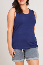 Model Poppy wearing size XL of The Transeasonal Knit Tank in colour Bluefizzer (Blue), from the front, cropped image