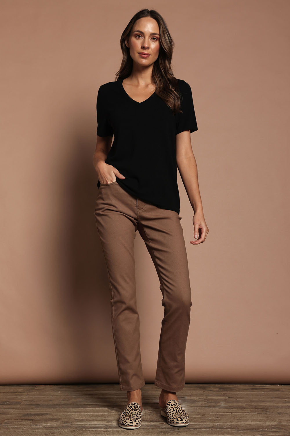 Model Madeline wearing size S of The Transeasonal Short Sleeve Jumper in colour Black (Black), from the front, showing the whole outfit