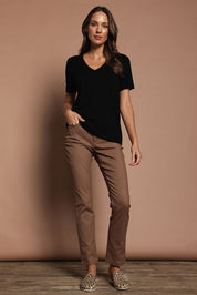 Model Madeline wearing size S of The Transeasonal Short Sleeve Jumper in colour Black (Black), from the front, showing the whole outfit