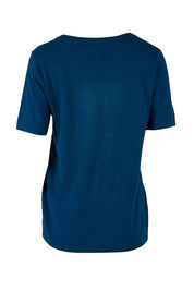 Product shot of The Transeasonal Short Sleeve Jumper in colour Petrol (Blue), from the back