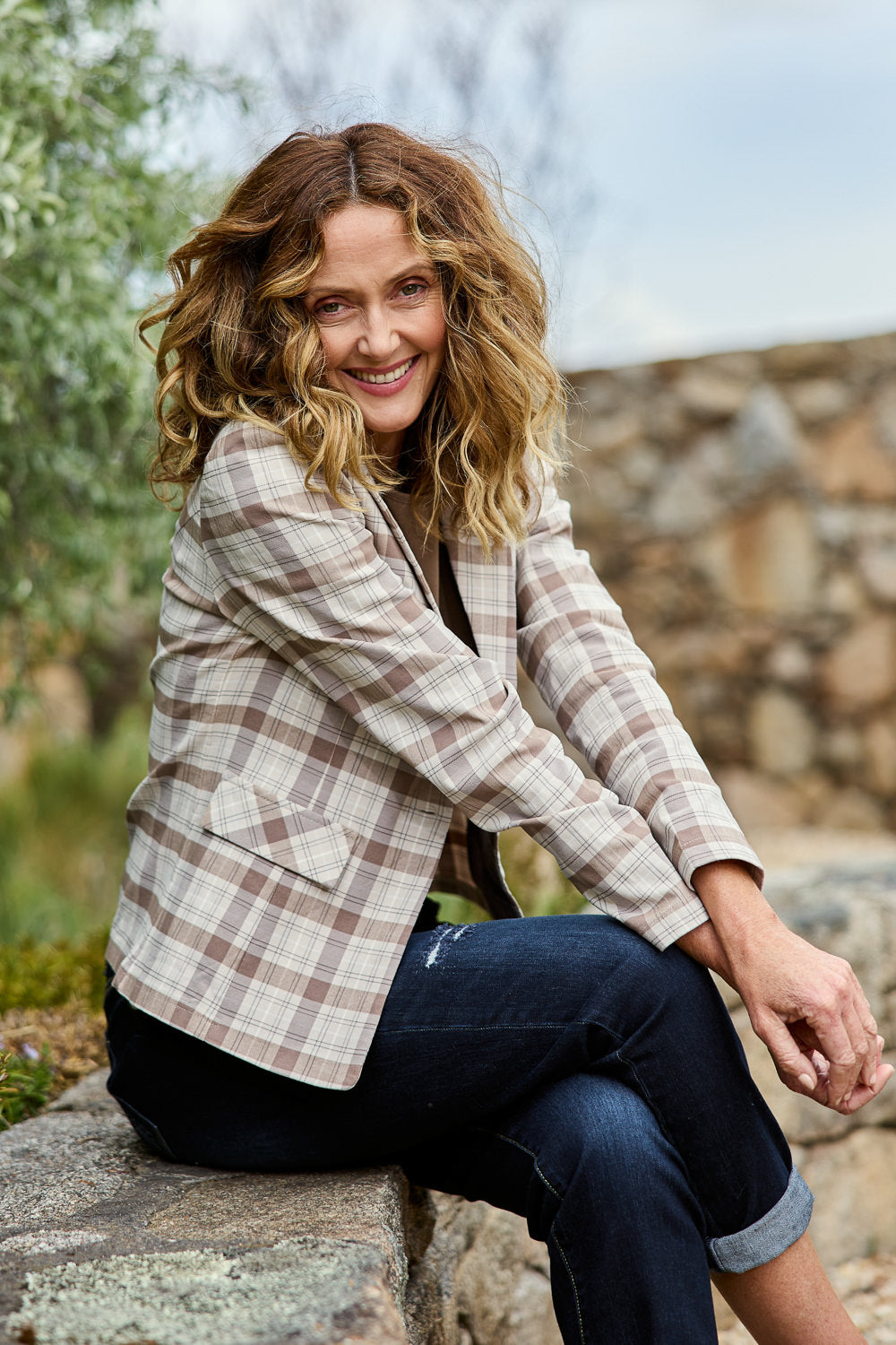 Model Emma wearing size 10 of The Classic Check Blazer in colour Fawncheck, from the front, showing the whole outfit