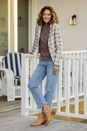 Model Emma wearing size 10 of The Classic Check Blazer in colour Fawncheck, from the front, showing the whole outfit