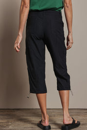 Model Amanda wearing size 10 of The Everyday Cropped Cargo Pant in colour Black (Black), from the back