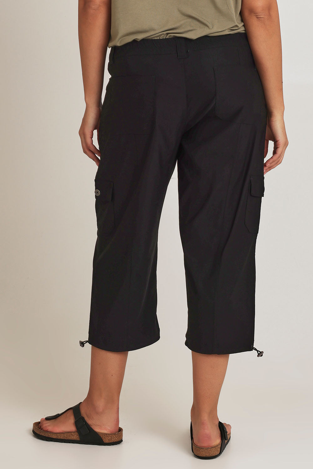 Model Terri-Leigh wearing size 14 of The Everyday Cropped Cargo Pant in colour Black (Black), from the back