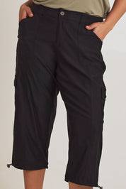 Model Terri-Leigh wearing size 14 of The Everyday Cropped Cargo Pant in colour Black (Black), from the front, cropped image