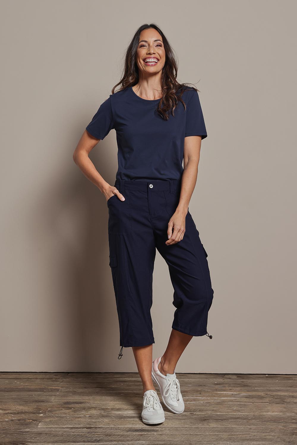 Model Amanda wearing size 10 of The Everyday Cropped Cargo Pant in colour Darknavy (Blue), from the front, showing the whole outfit